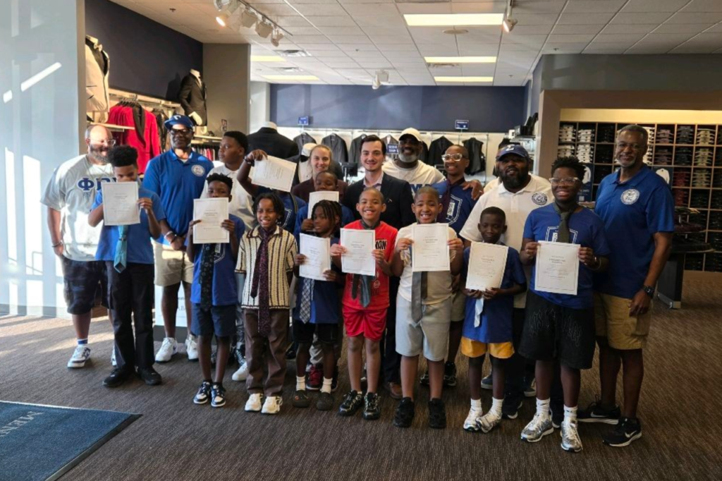 Sigma Beta Club youth proudly display certificates alongside Mission Blue Leadership mentors during a youth development and leadership program.