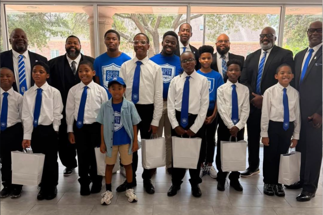 Sigma Beta Club youth members with Phi Beta Sigma mentors at a leadership event, celebrating mentorship, brotherhood, youth development, and community service.